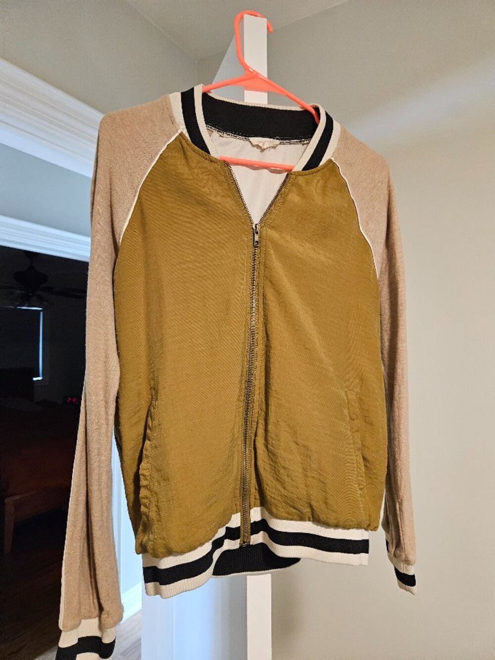 Mystree Tan and green light jacket